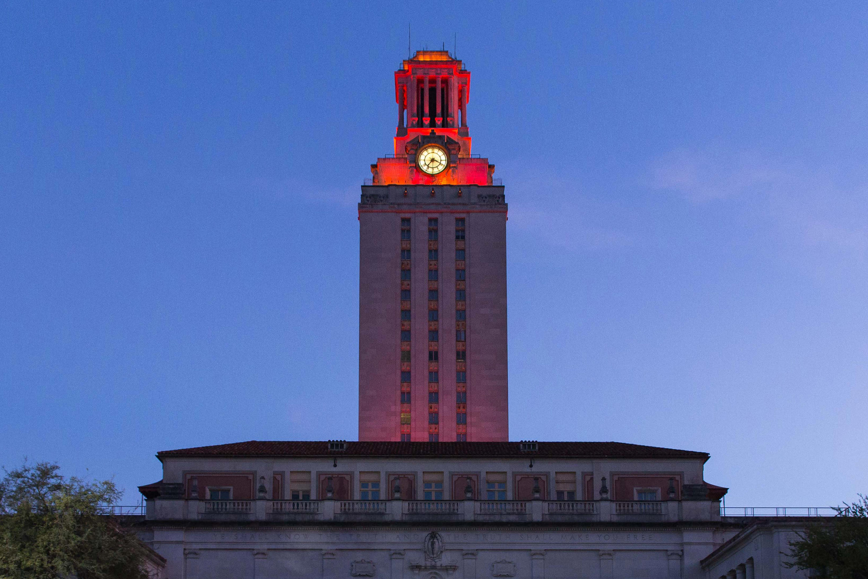 The UT tower lit burnt orange