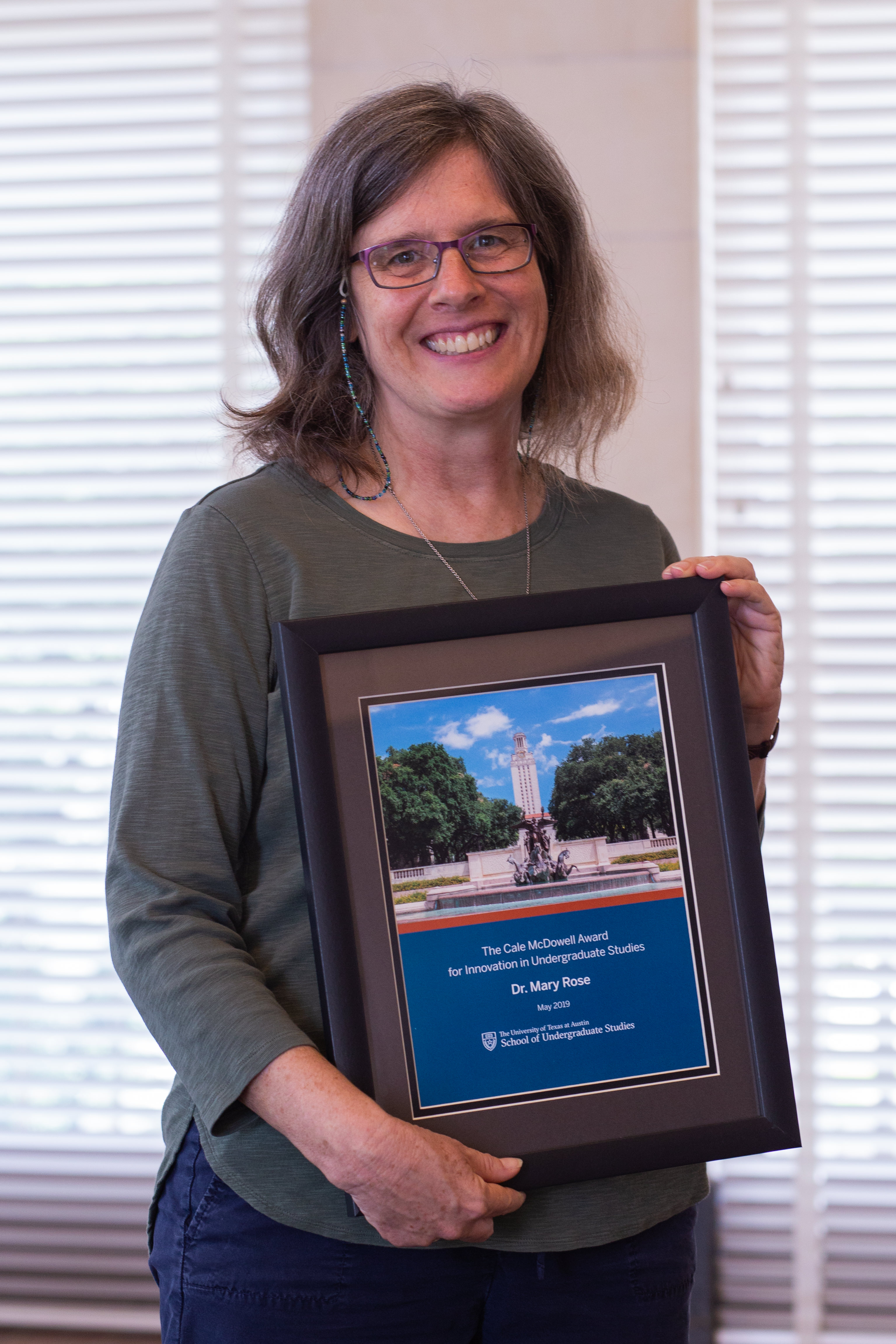 Dr. Mary Rose with her award