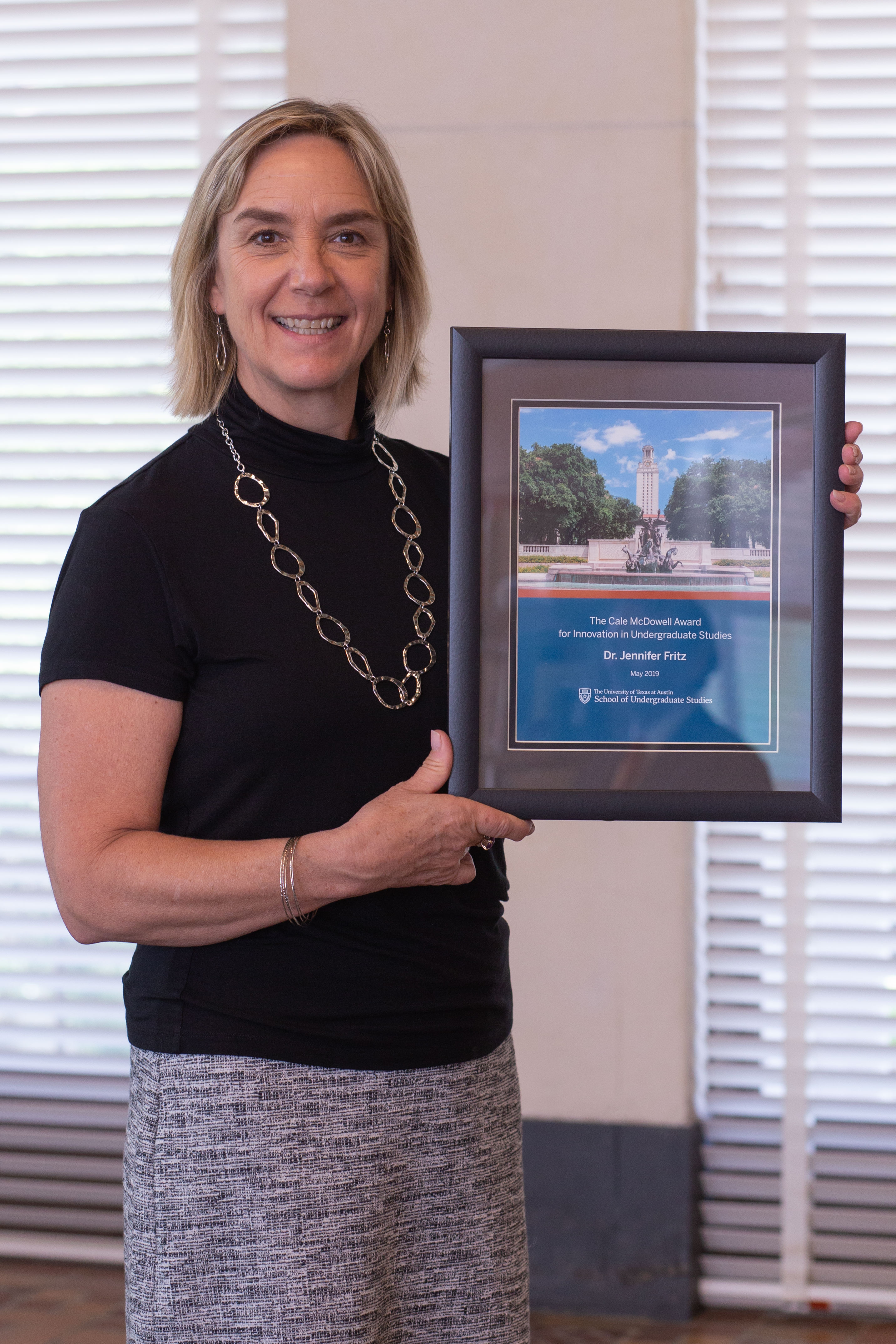 Dr. Jennifer Fritz with her award