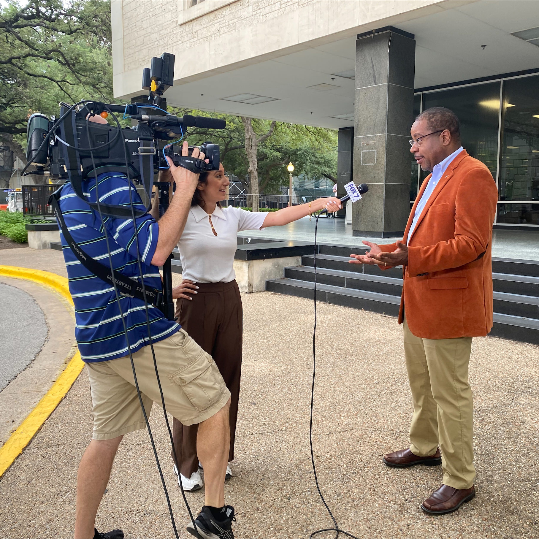Dr. Reddick speaks to a reporter from Fox 7 on the first day of the fall 2022 semester