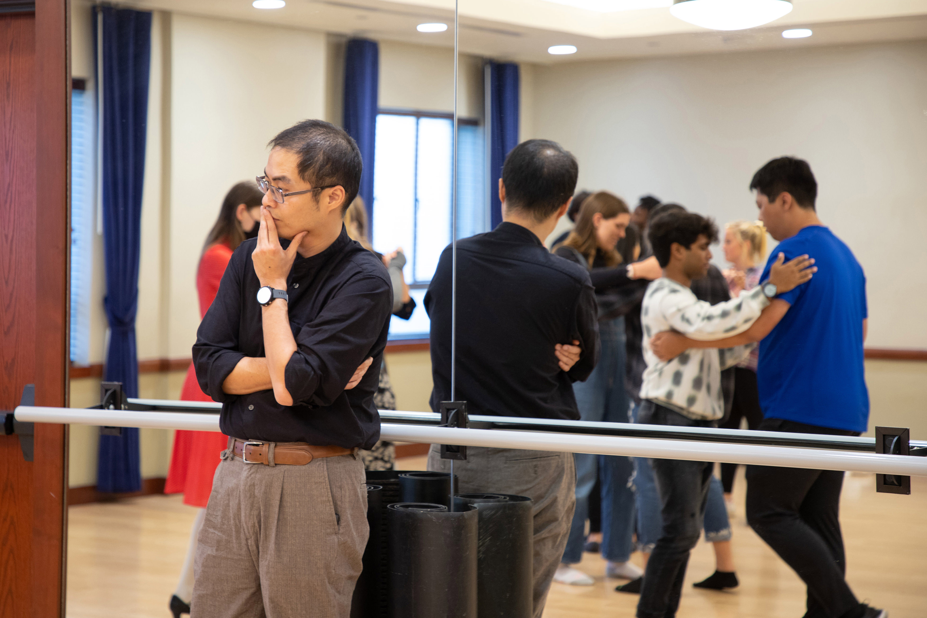 Dr. Ken-Hou Lin watches students dance in his Signature Course